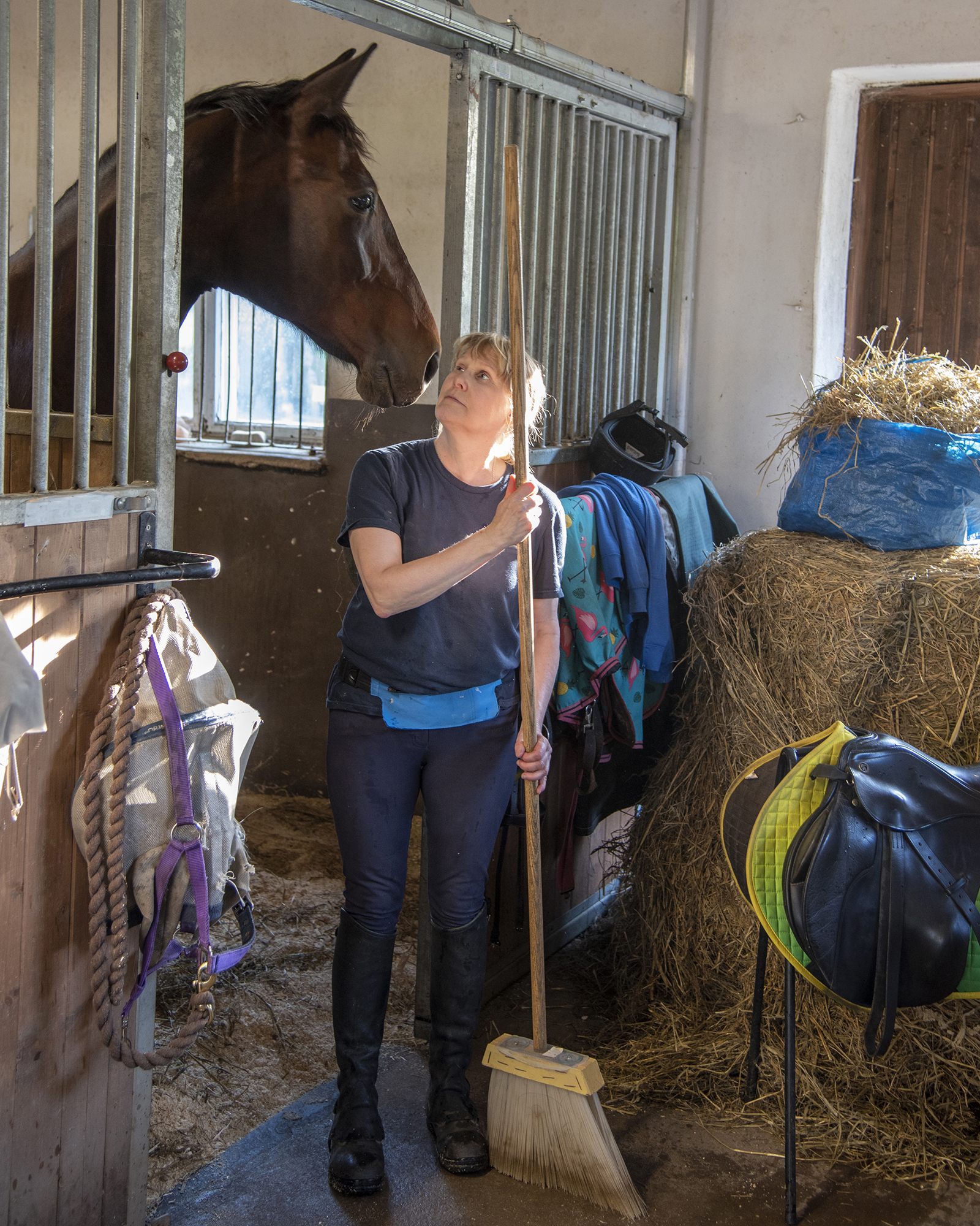 Woman And Horse In Stable
